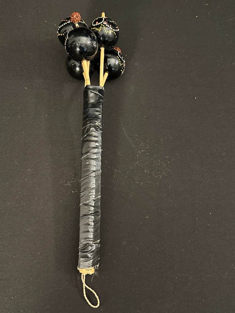 Ball Shaker on a Stick, black with details, 12" long, balls are 1.5" diameter