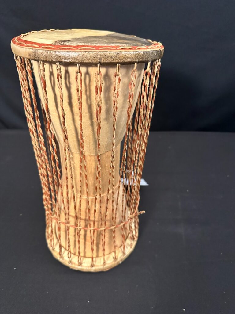 6" Talking Drum with skin heads, no beater, leather at stitching and ropes 12"H