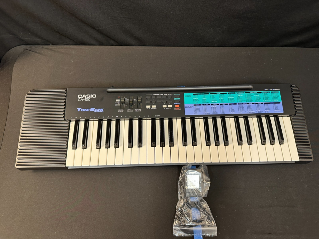 Casio CA-100 49-Key Electronic Keyboard with 100 sound tone bank, 100 beat bank.