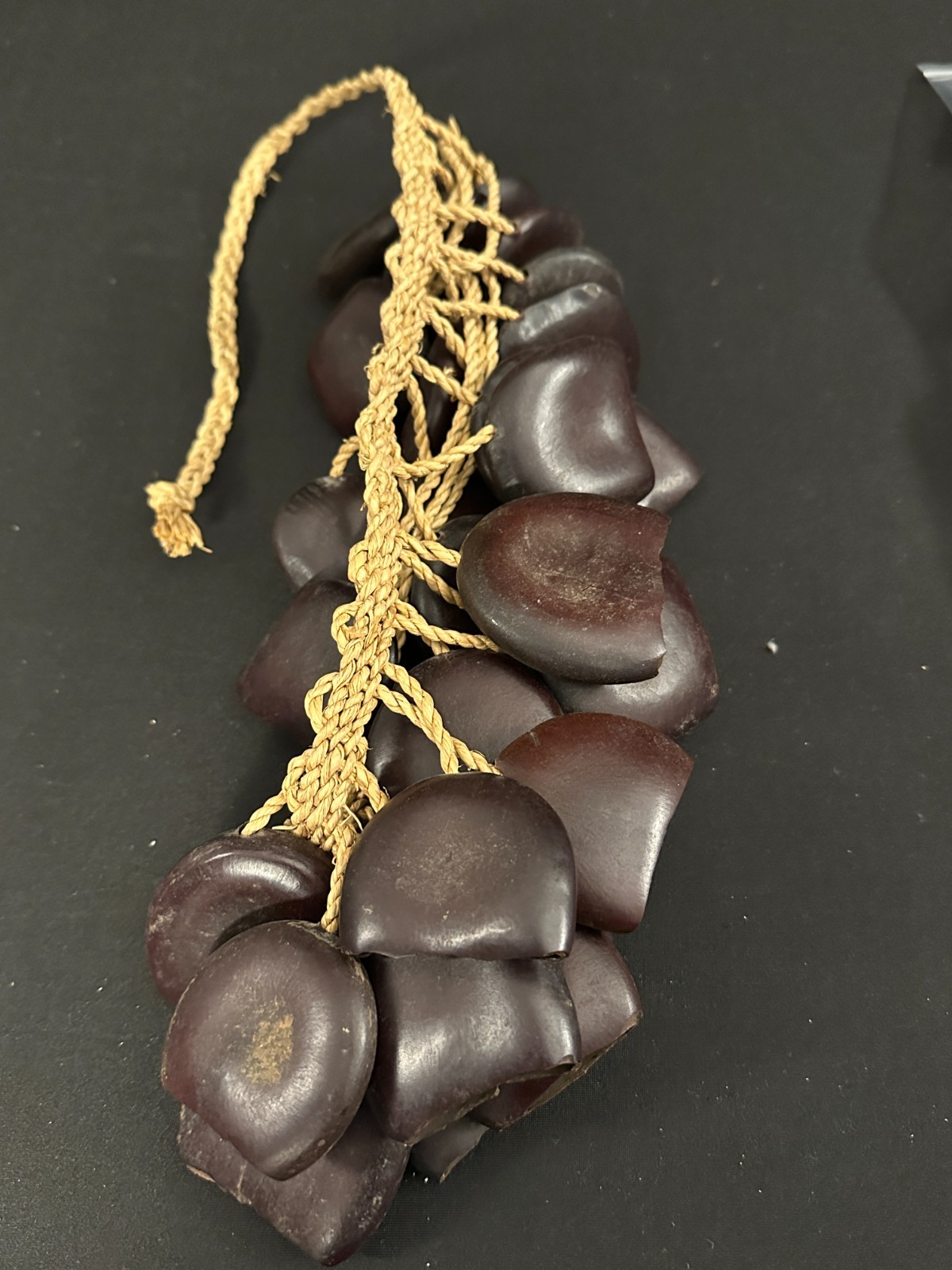Pair of Seed Pod shakers, dark brown, made in Cameroon, attached on woven rope - Image 6