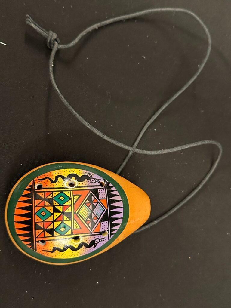 8 hole painted Clay Ocarina with necklace, 4in long